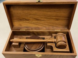 An award gavel set in a wooden display case from Awards By Hammond